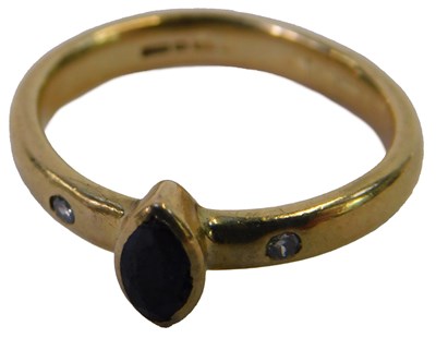 Lot 72 - A 9ct gold sapphire and diamond three stone...