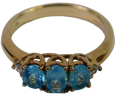 Lot 285 - A 9ct gold and apatite three stone ring, set...