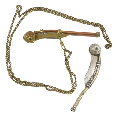 Lot 225 - A pair of Bosun's whistles, one in brass, one...