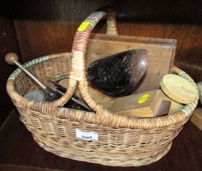 Lot 2008 - A wicker basket containing shoe stretchers, etc.
