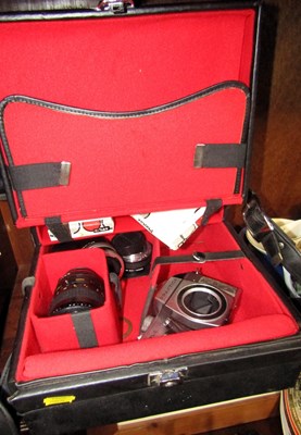 Lot 2015 - A cased Praktica SLR camera.