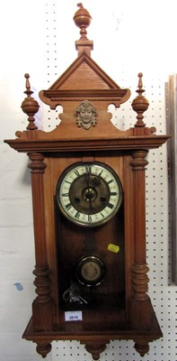 Lot 2019 - A wooden cased wall clock, Roman numerals to...