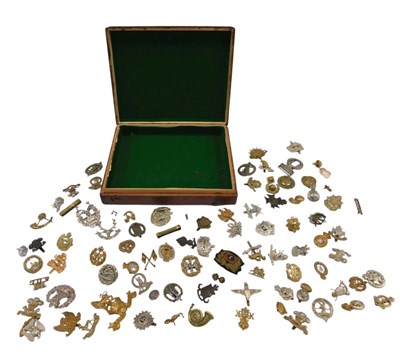 Lot 230 - A collection of military cap badges, WWI, WWII...