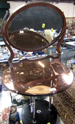 Lot 2040 - An occasional circular table with two tiers...