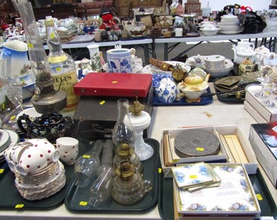 Lot 2053 - Two oil lamps, three small chimneys, paraffin...