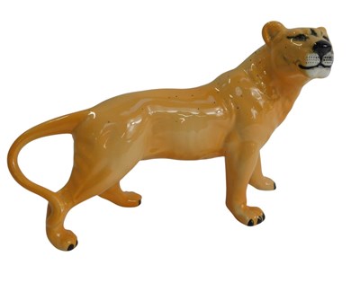 Lot 357 - A Beswick pottery figure modelled as a lioness,...