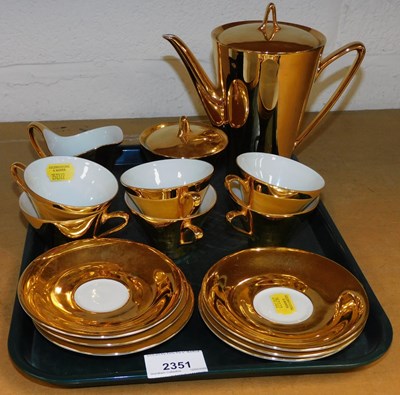 Lot 2351 - A gold coloured coffee service.