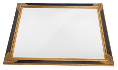 Lot 431 - A rectangular gilt and ebonised wall mirror,...