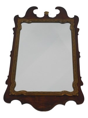 Lot 435 - A walnut and gilt fret frame wall mirror in...