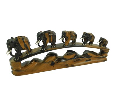Lot 398 - A 20thC ebony figure group, modelled as a...