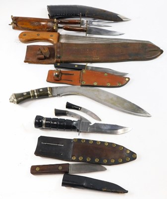 Lot 252 - A selection of knives, kukris, and machetes,...