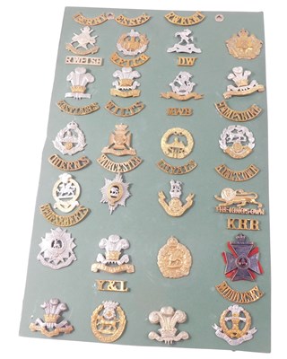Lot 268 - A collection of cap badges and shoulder titles,...