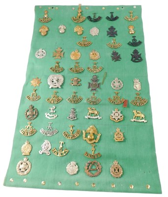 Lot 269 - A collection of cap badges and shoulder titles,...