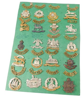 Lot 280 - A collection of cap badges and shoulder titles,...