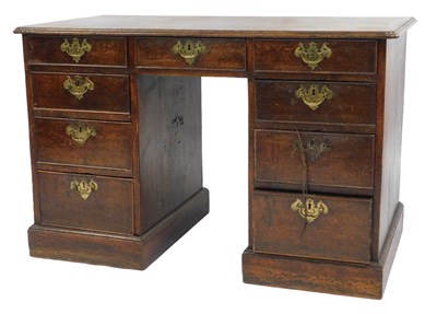 Lot 470 - A 19thC oak kneehole desk, the rectangular top...