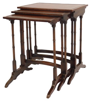 Lot 473 - A nest of three Regency style mahogany tables,...