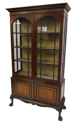 Lot 457 - An early 20thC mahogany display cabinet, the...
