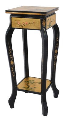 Lot 497 - An Oriental style ebonised and gilt plant...