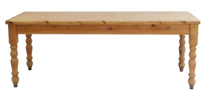 Lot 498 - A pine kitchen table, the rectangular top with...