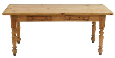 Lot 499 - A pine kitchen table, the rectangular top with...