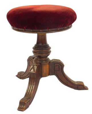 Lot 504 - A late Victorian walnut adjustable piano stool,...