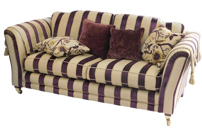 Lot 515 - An Alstons sofa, upholstered in purple and...