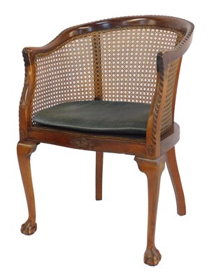 Lot 530 - A mahogany bergere library chair, with a...