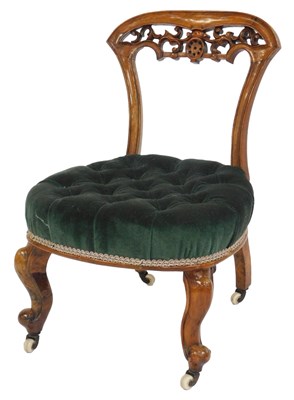 Lot 534 - A Victorian walnut nursing chair, with a...