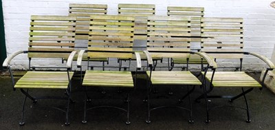 Lot 541 - A set of seven folding teak and ebonised metal...