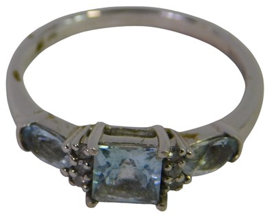 Lot 299 - A 9ct white gold and aquamarine three-stone...