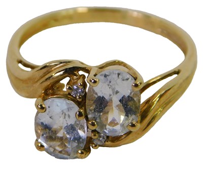 Lot 319 - A 9ct gold and aquamarine two-stone ring,...
