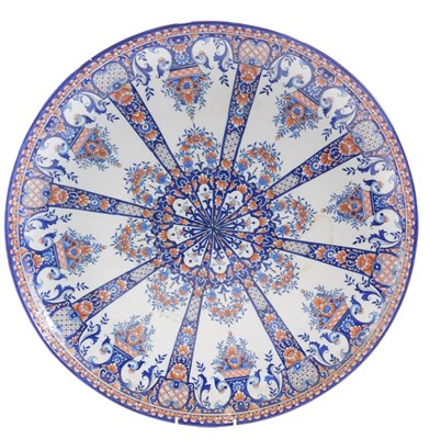 Lot 293 - A large HB Quimper faience dished charger, in...