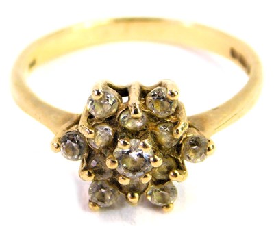 Lot 321 - A 9ct gold and CZ flower  head ring, size N/O,...