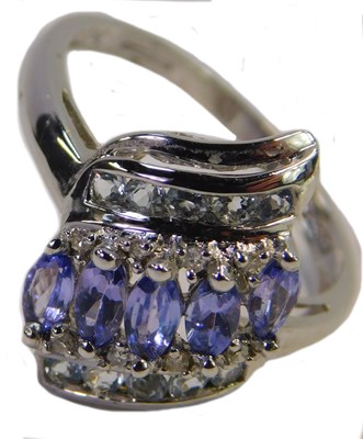Lot 322 - A 9ct gold amethyst and CZ ring, in a tiered,...