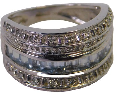Lot 323 - A 9ct white gold dress ring, size K, 5g.