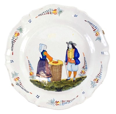 Lot 315 - A 19thC large Quimper Faience plate, decorated...