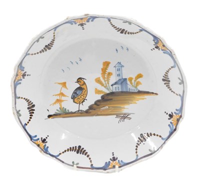 Lot 327 - An 18thC La Rochelle Faience plate, decorated...