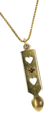 Lot 80 - A 9ct gold and garnet set pendant, modelled as...