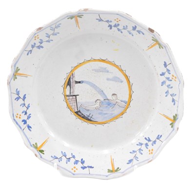 Lot 332 - An 18thC French Faience plate, decorated with...