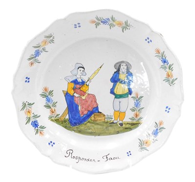 Lot 334 - A 19thC large Quimper Faience plate, decorated...