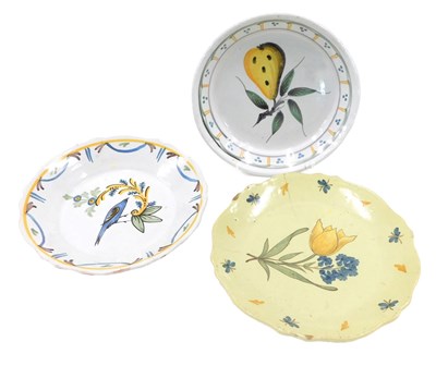 Lot 335 - Three French Faience plates, one decorated...