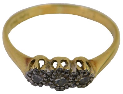 Lot 84 - A gold and diamond three stone dress ring,...