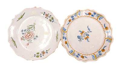 Lot 310 - An 18thC French Faience plate, decorated with...