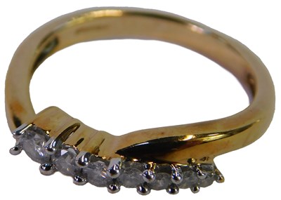 Lot 87 - A 9ct gold and diamond six stone ring, in a...