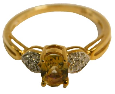 Lot 91 - A 9ct gold citrine and diamond ring, with a...