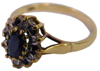 Lot 92 - A 9ct gold sapphire and diamond flower head...