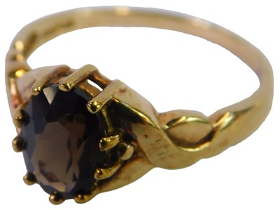 Lot 96 - A 9ct gold and smokey quartz ring, size N, 2g.
