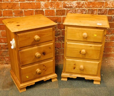 Lot 1004 - A pair of pine bedside chests, each with a...