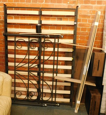 Lot 1012 - A metal framed double bed, 4ft 6", with...