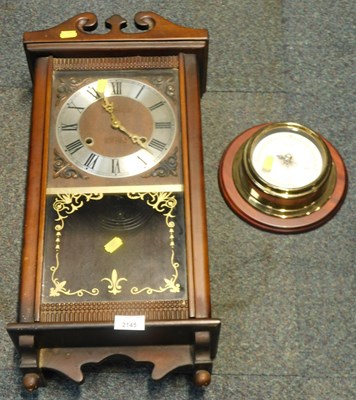 Lot 2145 - A wall barometer, and a wall clock.